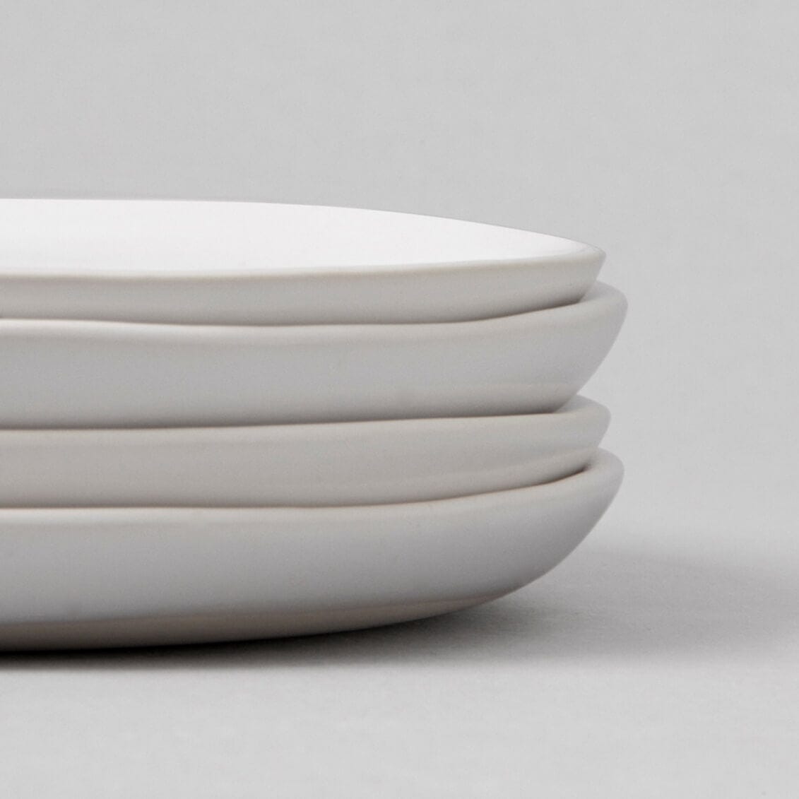 Lunch plates dinnerware by Fable Home, shown in a cloudwhite finish, sidy view. – #cloudwhite