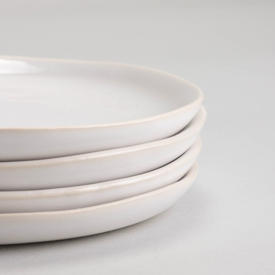 Lunch plates dinnerware by Fable Home, shown in a pearlwhite finish, side view. – #pearlwhite